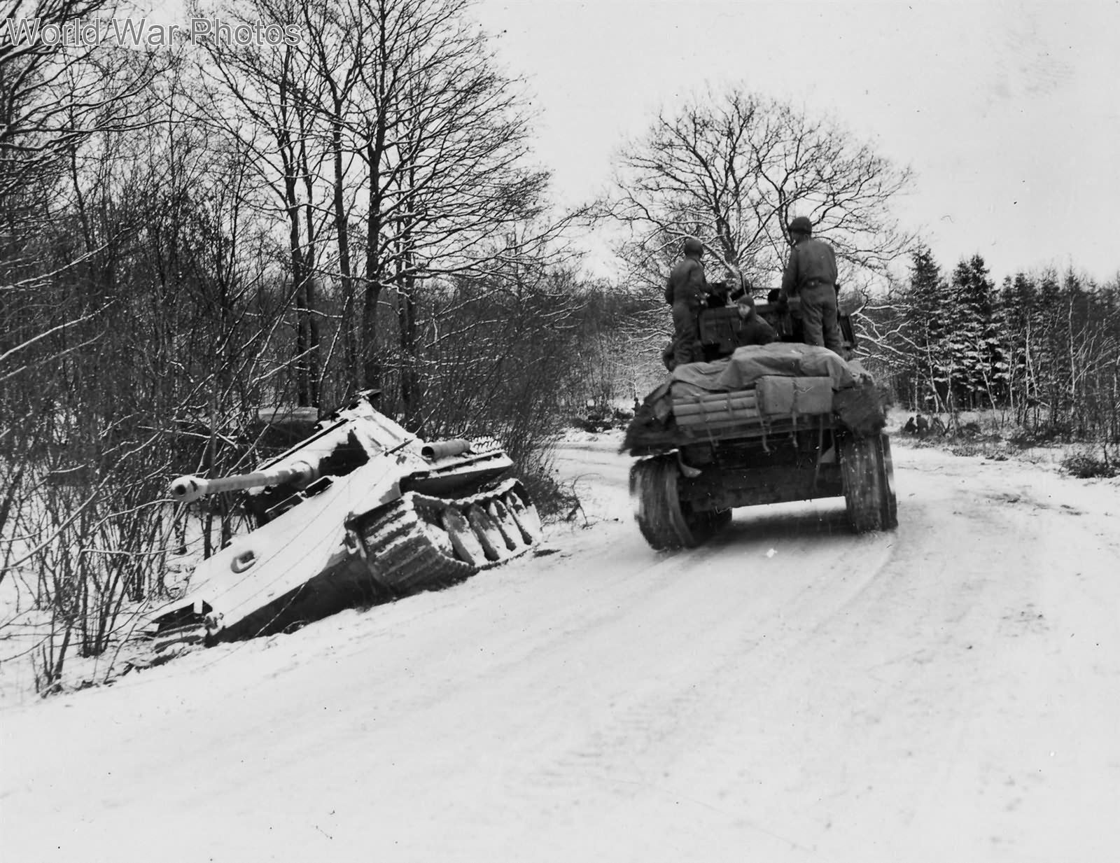M4 of the 2nd Armoured Division passes Panther tank, Menil Belgium 2 January 1945