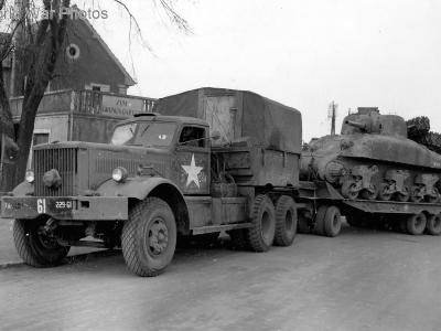 M19 Tank Transporter carrying a Sherman