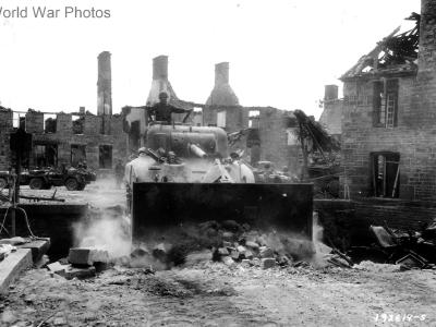 M4A1 bulldozer of 66th Regiment clears the central bridge in Lonlay-l’Abbaye August 1944