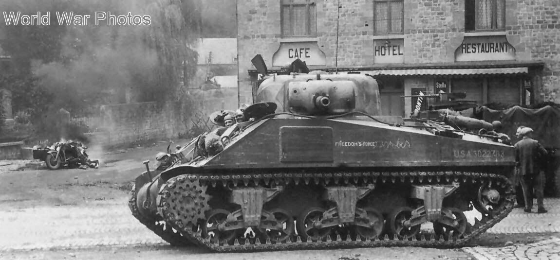 M4 of the 33rd AR, 3rd AD guarding the crossroads in Spontin Belgium September 1944