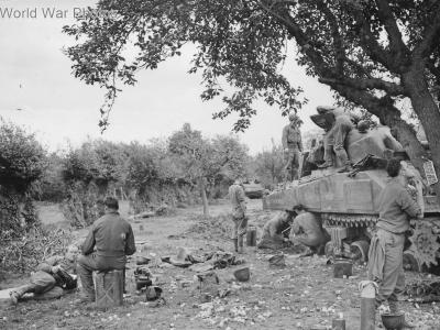 Sherman crew repairs track in Alsdorf 15 October 1944