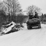 M4 of the 2nd Armoured Division passes Panther tank, Menil Belgium 2 January 1945