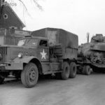 M19 Tank Transporter carrying a Sherman