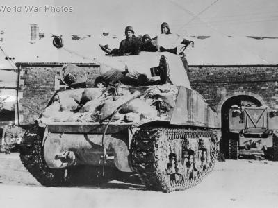Sherman camouflaged with sheets in Samree Belgium January 1945