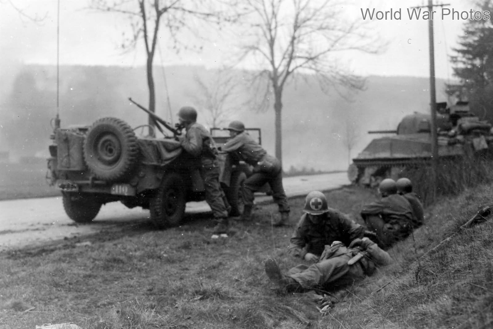 3rd AD medic treats wounded under fire Korbach Germany 5 March 1945