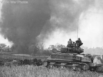 Crew atop M4A2 Sherman