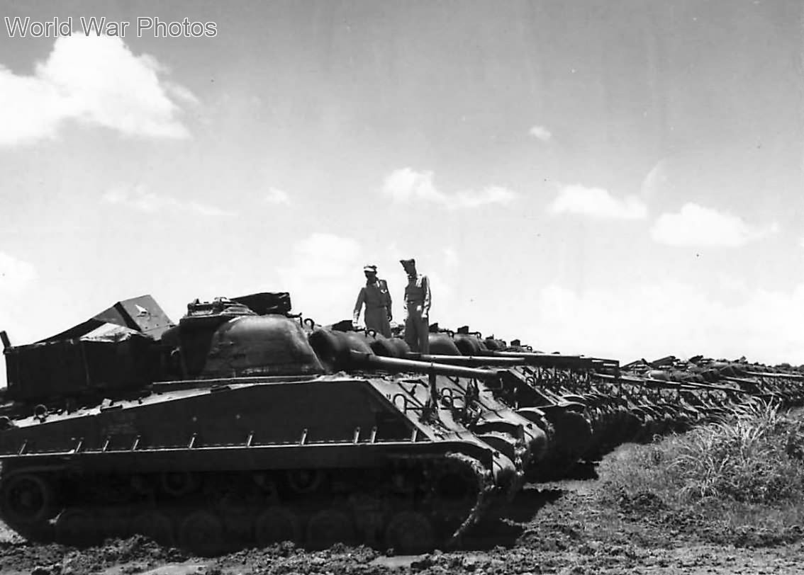 Shermans M4A3E8(75)W HVSS lined up at depot near Manila 1945