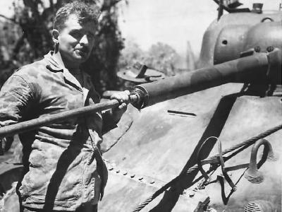Marine cleaning the 75mm gun of his M4 Cape Gloucester 1944