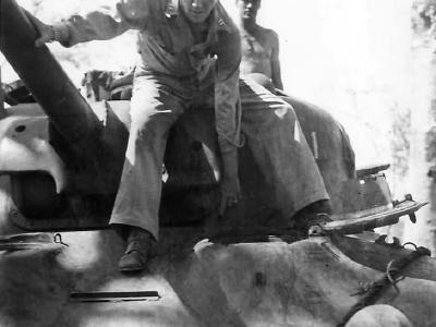 Marine points to hits scored on M4 tank on Cape Gloucester 44