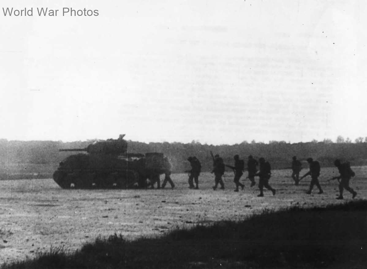 Marines advance on Peleliu air strip under cover of tank M4