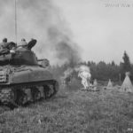 Flame throwing tank M4A1(76)W blasts haystack in Belgium 1944
