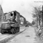 Shermans moving thru streets of Aachen
