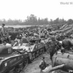 Shermans of 12e regiment de chasseurs d’Afrique (RCA) in concentration after coming ashore in Normandy August 1944