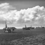 US Navy Escort Carriers and Cruiser at Forward Pacific Base 1945