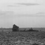 Battleship USS Arkansas fires at German positions, Omaha Beach on D-Day