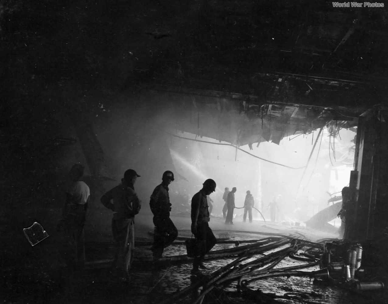 The damage to USS Bunker Hill caused by a kamikaze