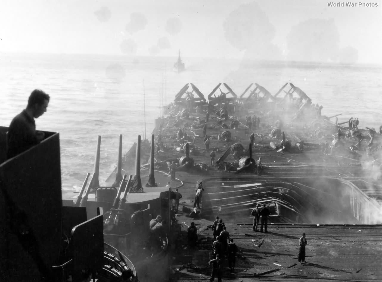 View over the damaged flight deck of USS Bunker Hill (CV-17)
