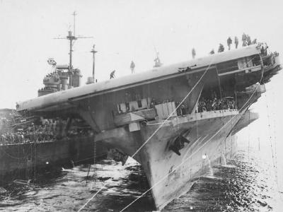 USS Santa Fe CL-60 helps USS Franklin CV-13 near Japan