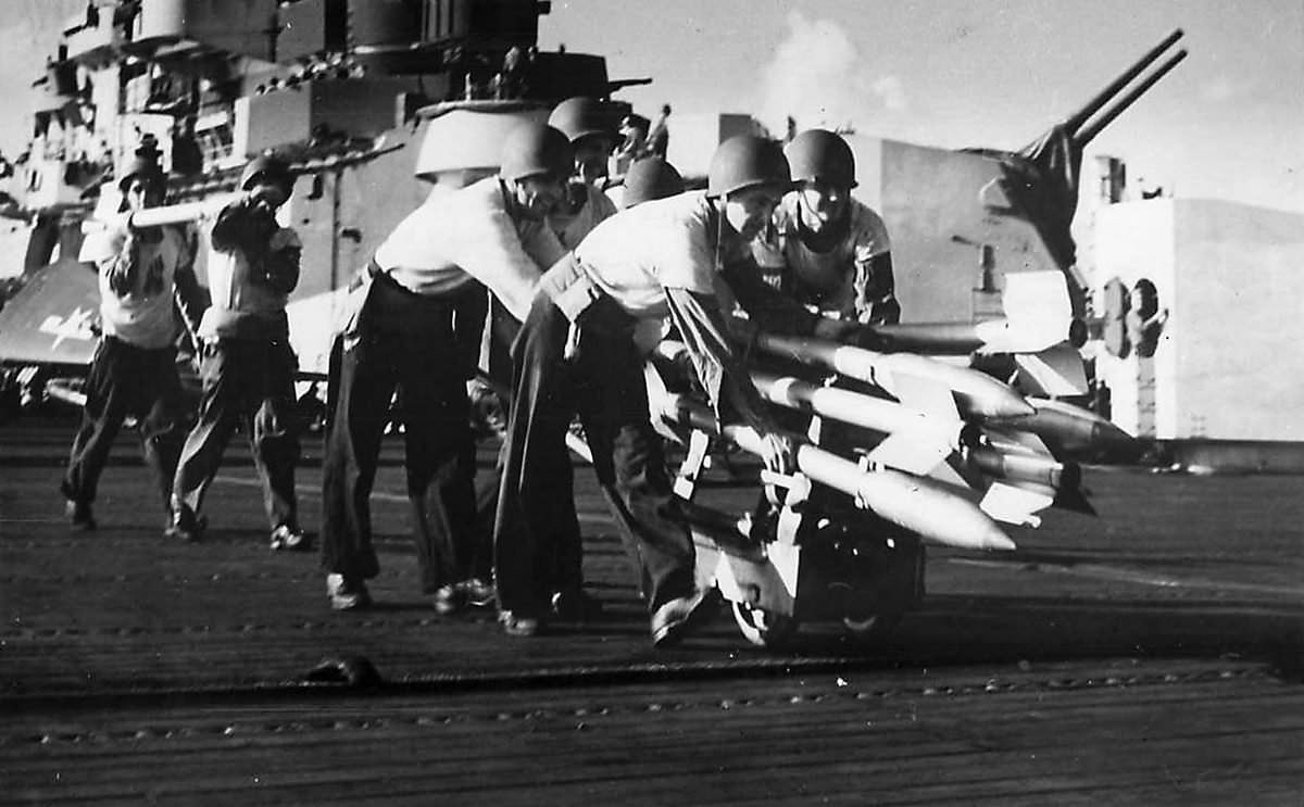 Crewmen on USS Hancock move rockets to planes for strike on Formasa 1944