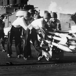 Crewmen on USS Hancock move rockets to planes for strike on Formasa 1944