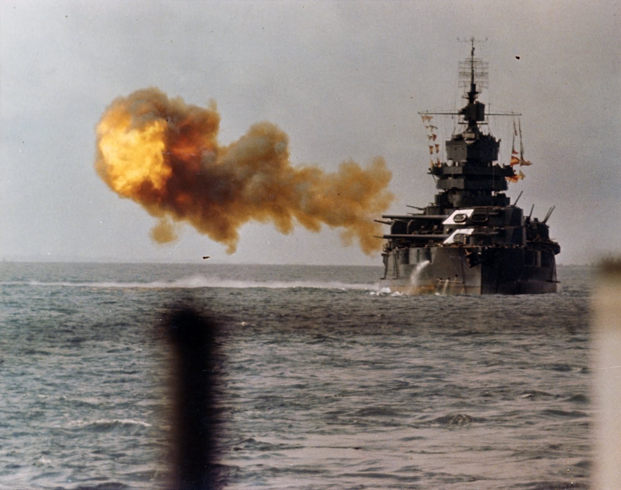 USS Idaho (BB-42) bombarding Okinawa 1 April 1945 – color photo