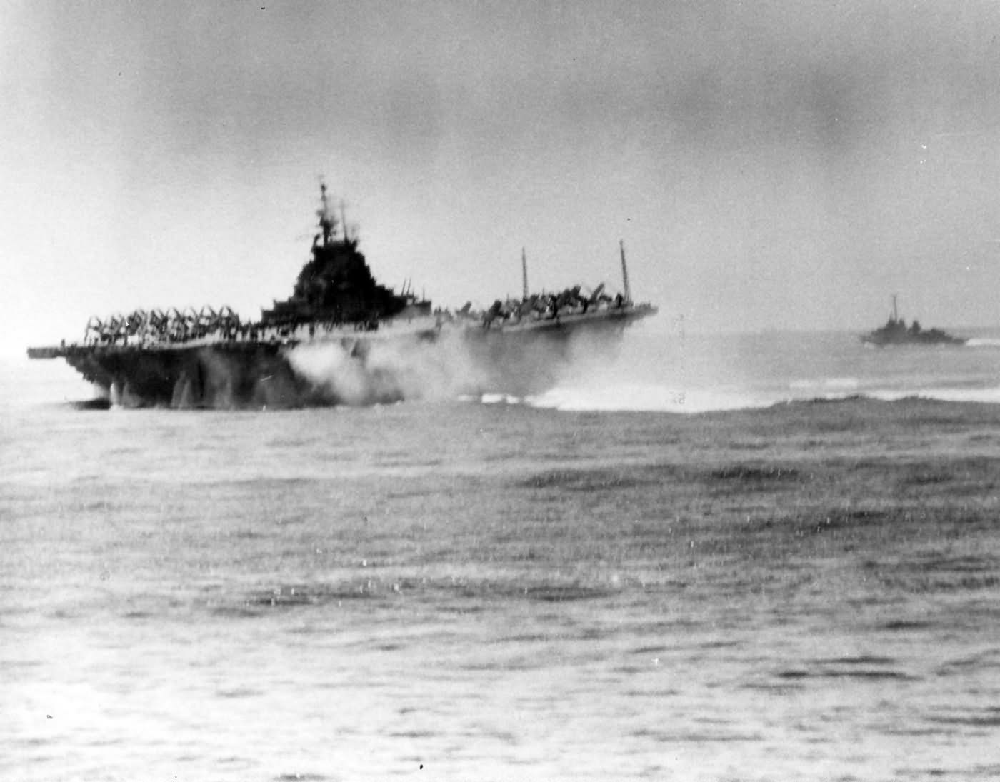 USS Intrepid CV-11 pictured after being hit by kamikaze