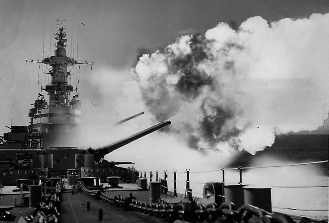 Battleship USS Iowa fires salvo from one of three 16 inch turret