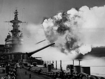 Battleship USS Iowa fires salvo from one of three 16 inch turret