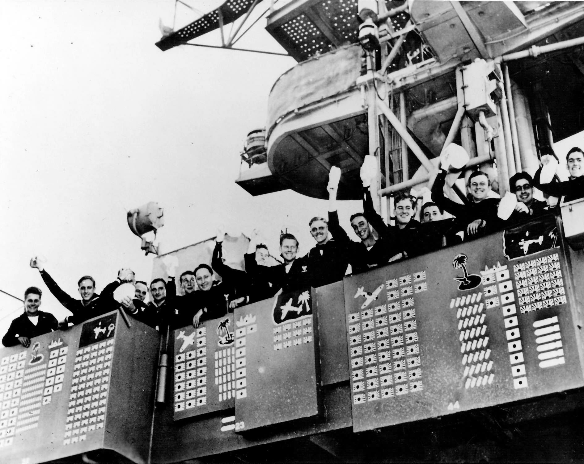 Sailors on board the light aircraft carrier USS Langley