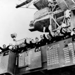 Sailors on board the light aircraft carrier USS Langley