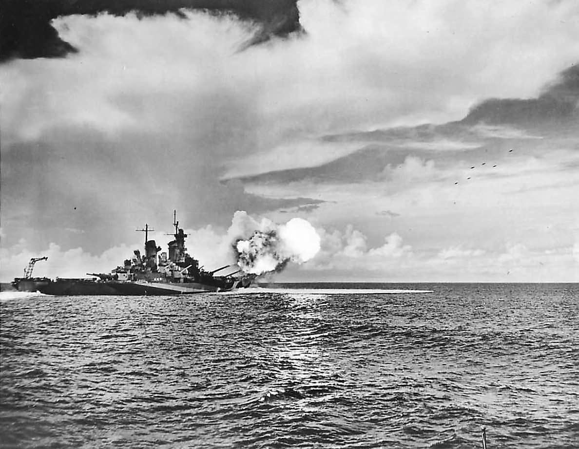 Projectiles in air as USS Missouri (BB-63) fires 406 mm (16 in) guns
