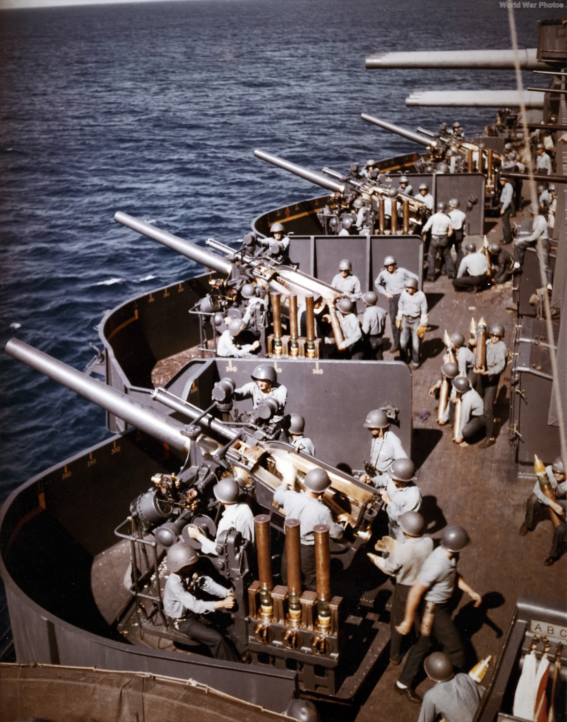 USS New Mexico 5 inch battery prepares to fire during the bombardment of Saipan 15 June 1944