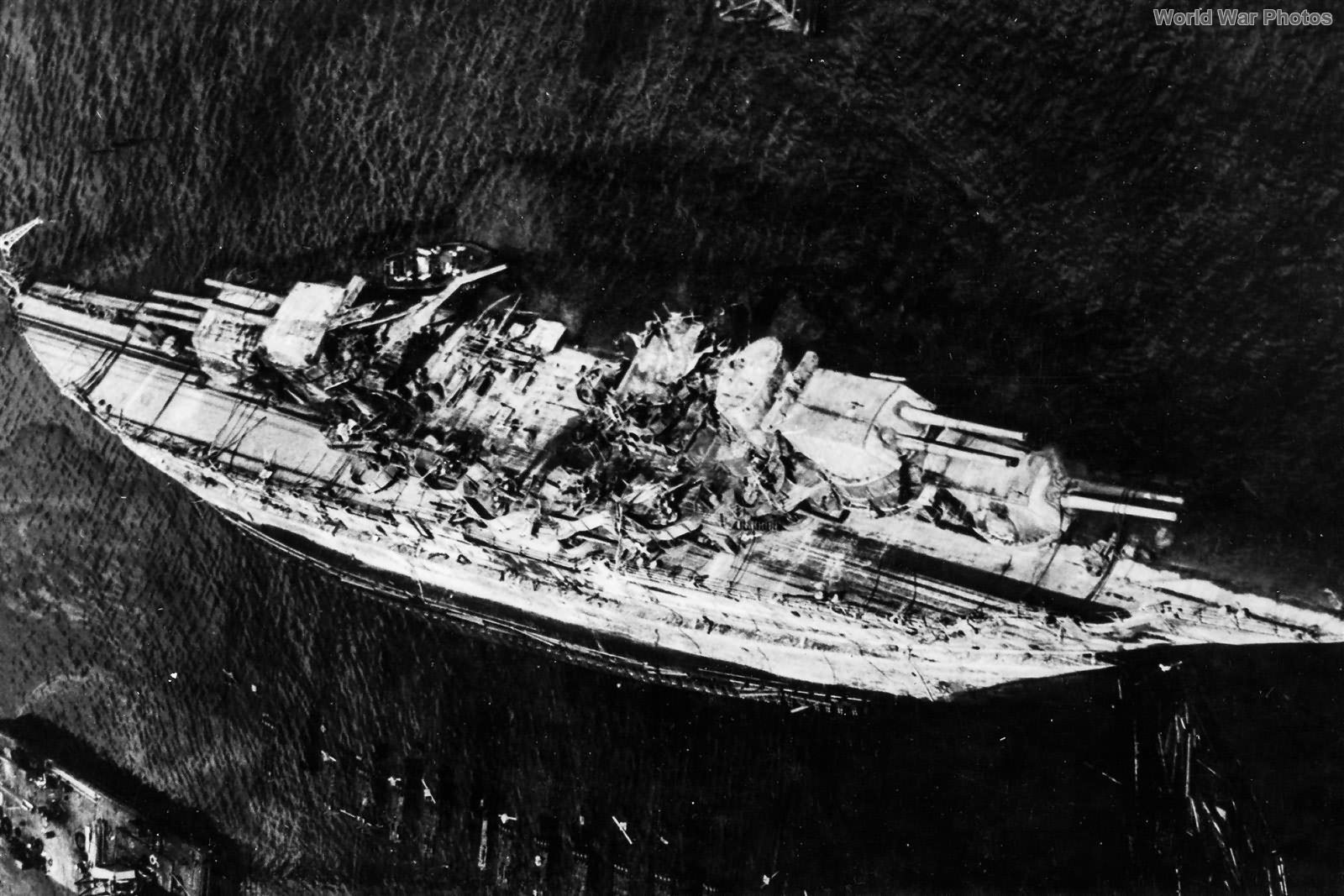 Aerial View of USS Oklahoma being righted May 1943