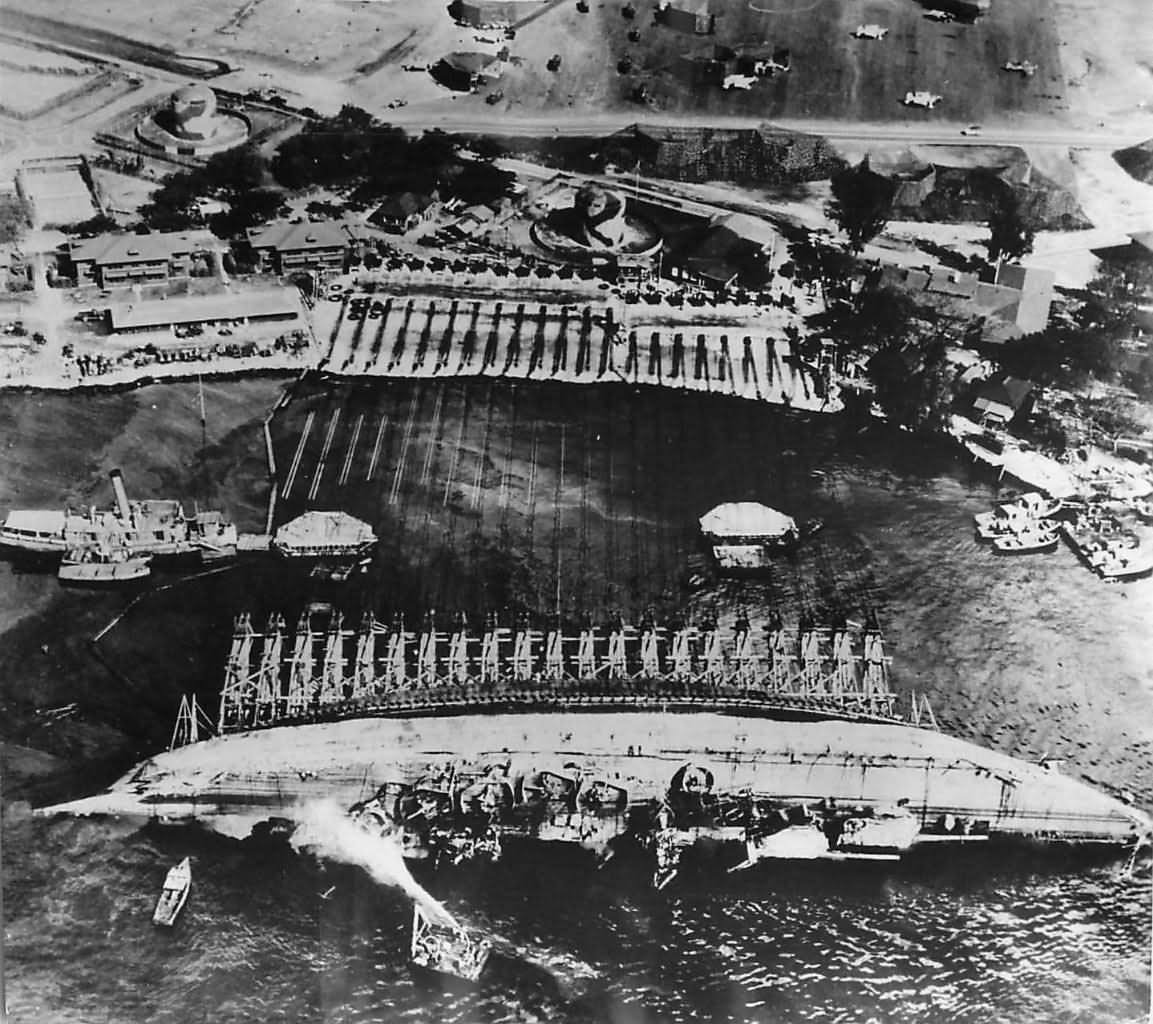 Crew work in Pearl Harbor to right the battleship USS Oklahoma 1943