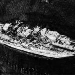 Aerial View of USS Oklahoma being righted May 1943