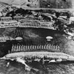Crew work in Pearl Harbor to right the battleship USS Oklahoma 1943