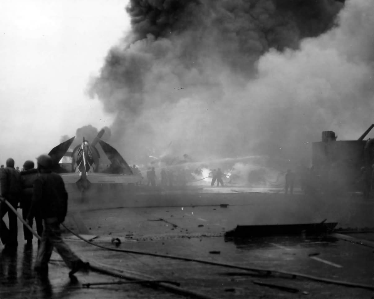 Fire fighteing detail, battling flames on the flight deck of the USS Saratoga