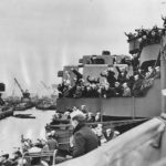 Sailors crowd decks USS Tennessee at docks at Philadelphia, 7 December 1945