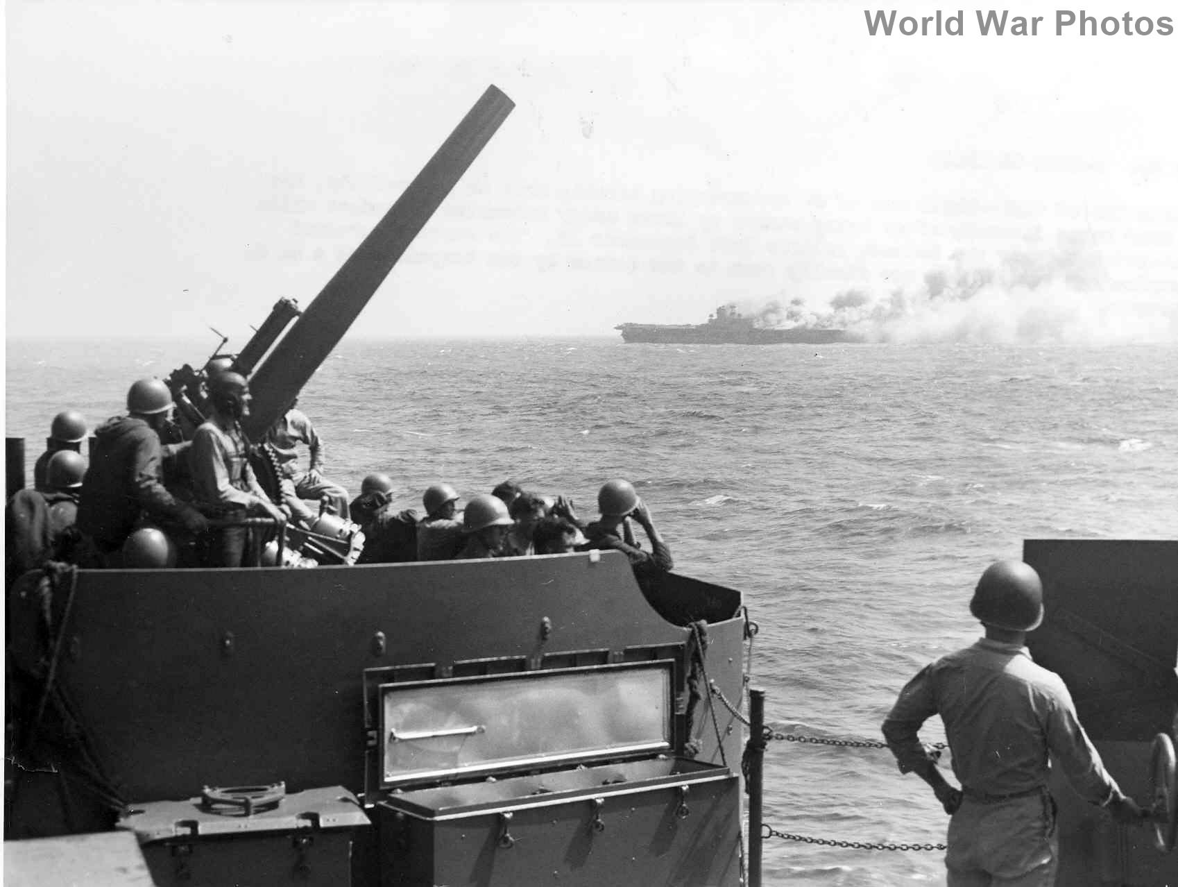 USS Wasp burn after she was torpedoed while operating in the Solomon Islands