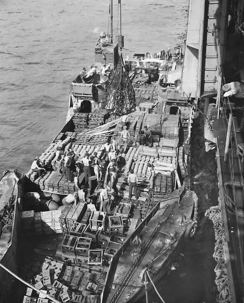 LCT loaded with ammo alongside USS Yorktown 1945