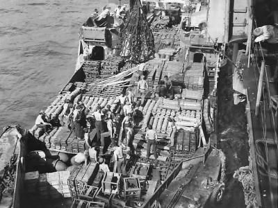 LCT loaded with ammo alongside USS Yorktown 1945