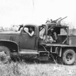 U.S. troops in a Chevrolet E-5 turret training truck in New Guinea, 1943