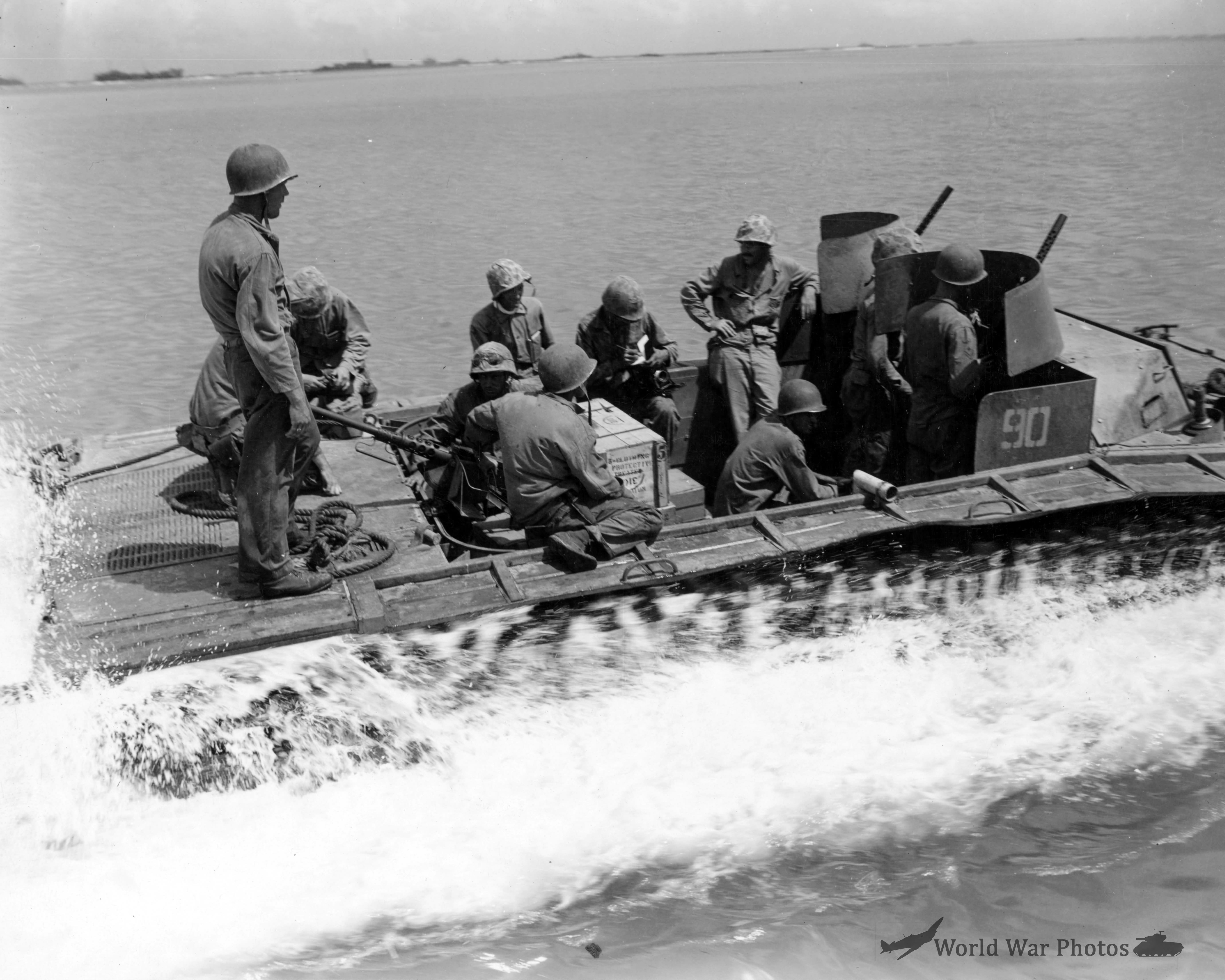 LVT-2 pulls away from LCM with rations headed for the frontlines Saipan