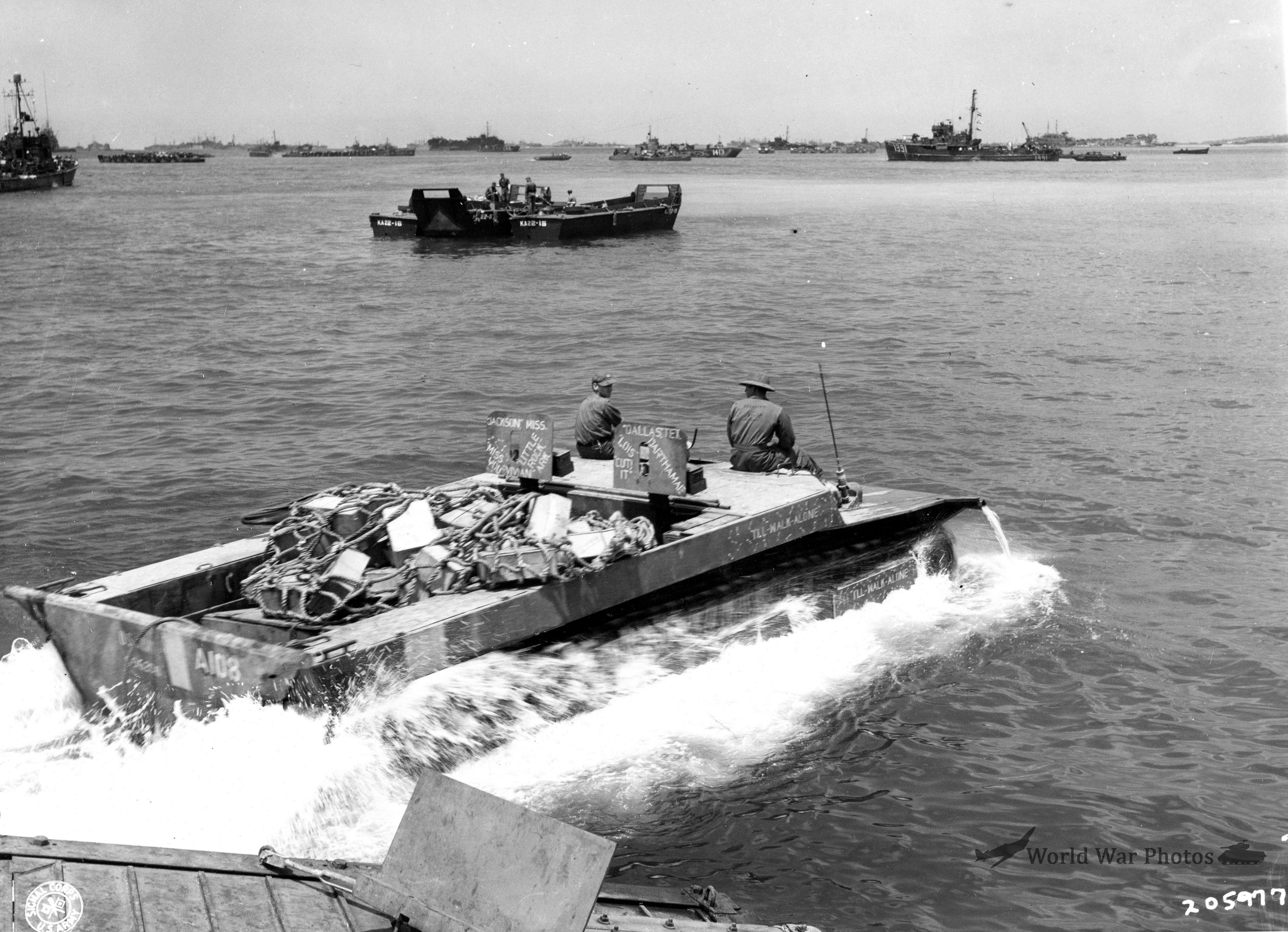 LVT-4 loaded with supplies removed from an LSVP heads for the beach of Okinawa