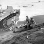 Marines carry a wounded comrade to an evacuation point on Iwo Jima beachhead