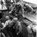 Transferring from Higgins Boats to amphibious tractors Guadalcanal 10 March 1944