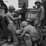 Wounded Marine receives treatment aboard an LVT at Peleliu