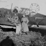 German soldiers posing beside a Su-2
