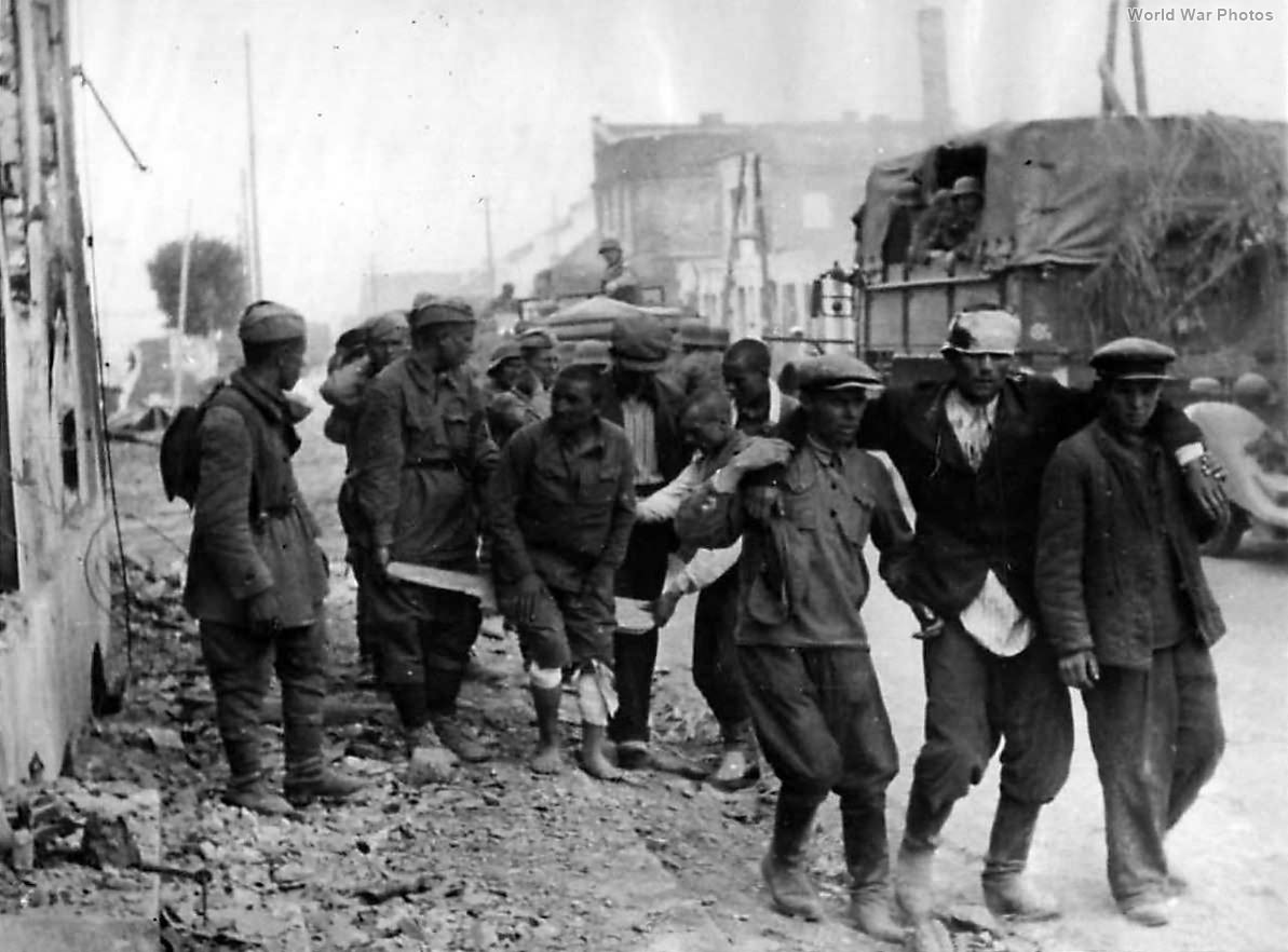 Russian soldiers support wounded comrades after German capture 1941