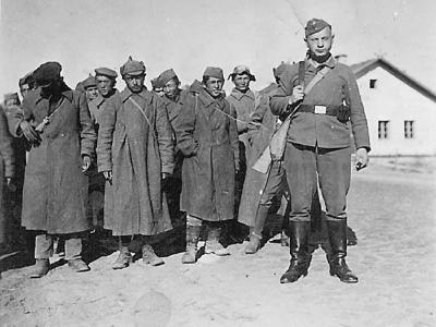 Wehrmacht Guard posed with Russian POW column